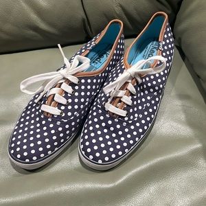 Ked’s brand blue and white polka dot sneakers.